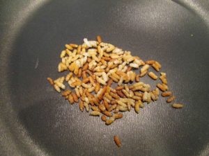 Roasting the dried rice in a pan